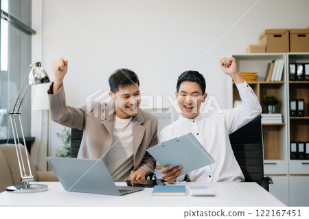 Young Asian business team creative businesspeople coworker, teamwork celebrating achievement 122167451