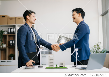 Discussion among businesspeople on the latest developments in solar cell panel technology and Solar Energy Environment city Concept Discussion among businesspeople on the latest developments in solar cell panel technology and Solar Energy Environment city Concept 122167718
