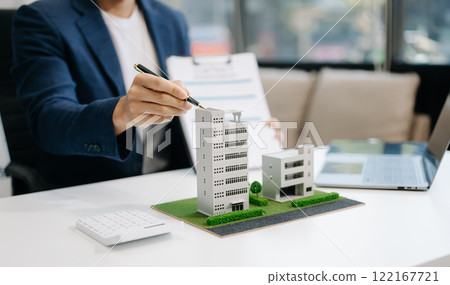 Considering buying a home, investing in real estate. Broker signs a sales agreement. agent, lease agreement, successful deal 122167721