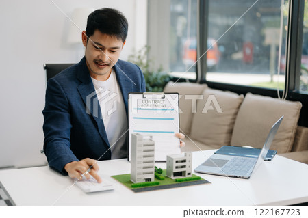 Considering buying a home, investing in real estate. Broker signs a sales agreement. agent, lease agreement, successful deal Considering buying a home, investing in real estate. Broker signs a sales agreement. agent, lease agreement, successful deal 122167723