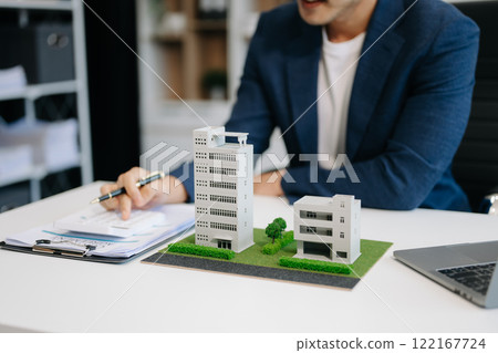 Considering buying a home, investing in real estate. Broker signs a sales agreement. agent, lease agreement, successful deal 122167724