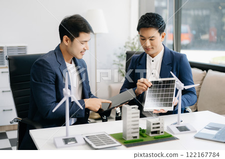 Discussion among businesspeople on the latest developments in solar cell panel technology and Solar Energy Environment city Concept. 122167784