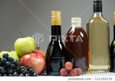 Different types of vinegar, Balsamic, pomegranate and apple vinegars in bottles Different types of vinegar, Balsamic, pomegranate and apple vinegars in bottles 122168250