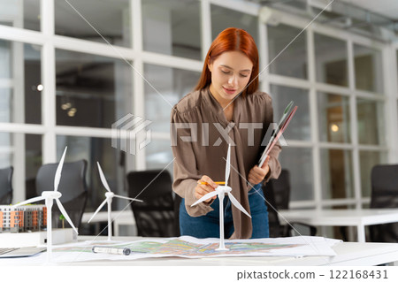 Female manager working in the office on planning a new project 122168431