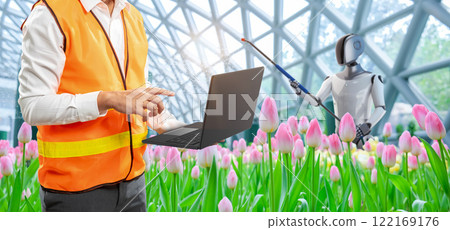 Engineer work with assistant robotic in smart indoor tulip field Engineer work with assistant robotic in smart indoor tulip field 122169176