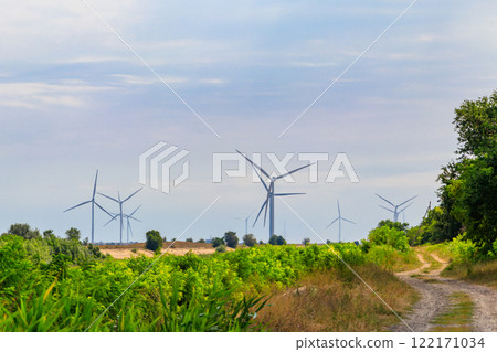 Wind turbines in a field. Renewable energy 122171034