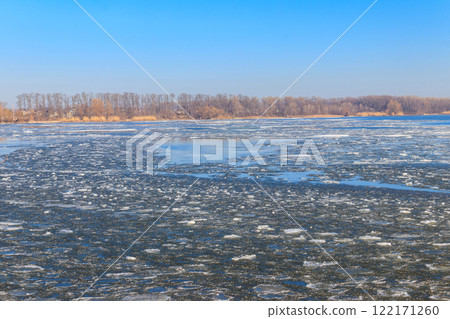 View of a lake with melting ice at spring View of a lake with melting ice at spring 122171260