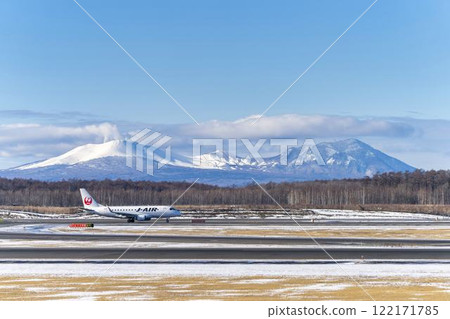 Planes at New Chitose Airport in winter, Mount Tarumae and Mount Fusubushi, Chitose, Hokkaido 122171785
