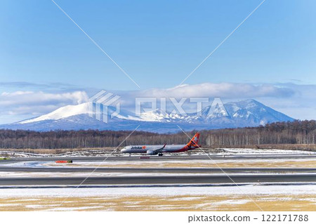 Planes at New Chitose Airport in winter, Mount Tarumae and Mount Fusubushi, Chitose, Hokkaido Planes at New Chitose Airport in winter, Mount Tarumae and Mount Fusubushi, Chitose, Hokkaido 122171788