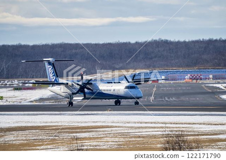 Winter at New Chitose Airport, landing plane, Chitose, Hokkaido Winter at New Chitose Airport, landing plane, Chitose, Hokkaido 122171790