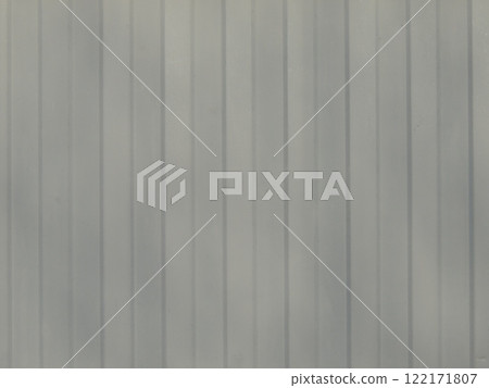 gray textured background with vertical stripes, fragment of metal sheet with convex grooves, part of iron fence as a designer background, iron material with curved relief and natural color 122171807