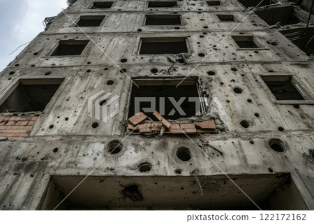 Damaged building facade with evidence of destruction and bullet holes Damaged building facade with evidence of destruction and bullet holes 122172162