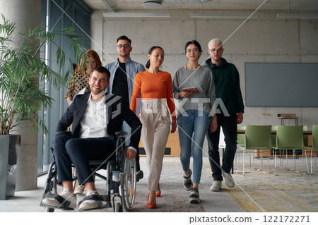 A diverse group of business professionals walking together through the office, symbolizing unity and strength as a collaborative and successful team A diverse group of business professionals walking together through the office, symbolizing unity and strength as a collaborative and successful team 122172271