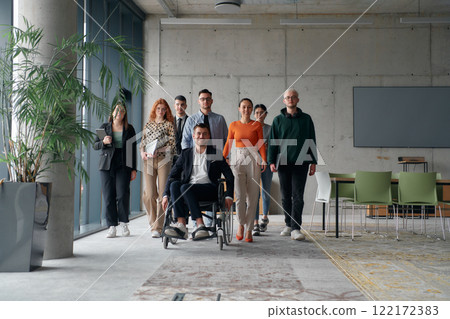 A diverse group of business professionals walking together through the office, symbolizing unity and strength as a collaborative and successful team A diverse group of business professionals walking together through the office, symbolizing unity and strength as a collaborative and successful team 122172383