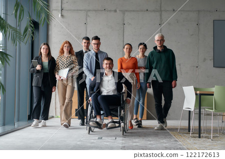 A diverse group of business professionals walking together through the office, symbolizing unity and strength as a collaborative and successful team 122172613