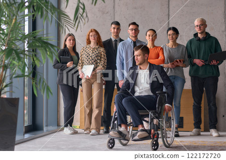 Multiethnic Business Team Collaborating in a Modern Office with Director in a Wheelchair 122172720