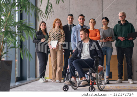 Multiethnic Business Team Collaborating in a Modern Office with Director in a Wheelchair 122172724