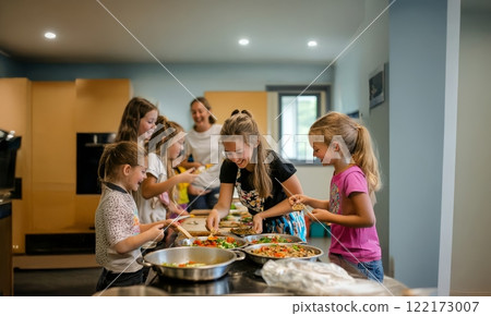 Children Enjoy Cooking and Learning Together in a Fun and Interactive Kitchen Class. Generated image Children Enjoy Cooking and Learning Together in a Fun and Interactive Kitchen Class. Generated image 122173007