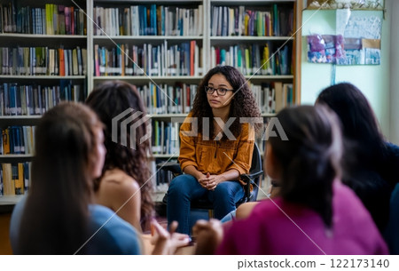 A school psychologist provides counseling to a diverse group of teenagers during a therapy session. Generated image 122173140