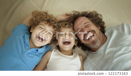 Father joyfully embracing his sons at home, lying on the floor and sharing laughter. Generated image Father joyfully embracing his sons at home, lying on the floor and sharing laughter. Generated image 122173163