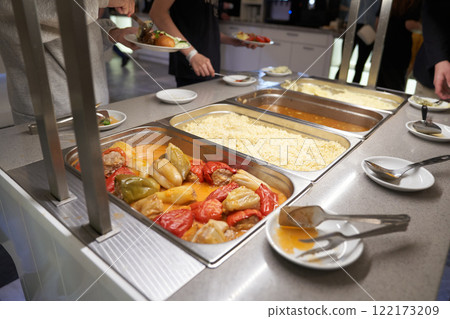 A buffet with Russian dishes, which features traditional dishes in metal containers. With space to copy. High quality photo A buffet with Russian dishes, which features traditional dishes in metal containers. With space to copy. High quality photo 122173209