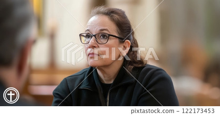 Priest listening attentively to a woman sharing her faith in church. Generated image 122173453