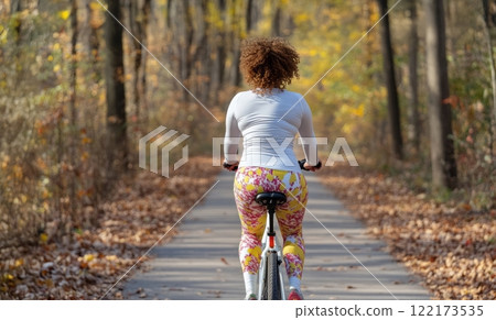 Confident Plus-Size Woman Enjoying a Bicycle Ride on a Crisp Autumn Morning. Generated image  122173535