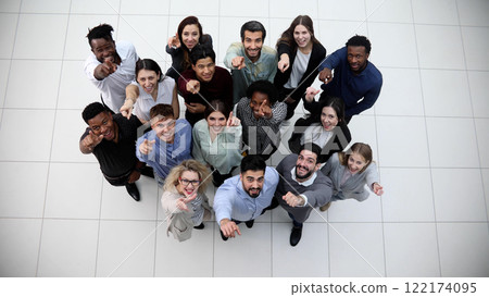 Diverse group of people standing together and waving Diverse group of people standing together and waving 122174095