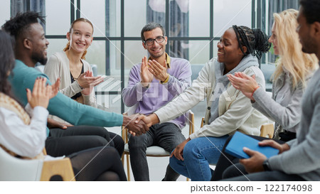 Happy diverse business colleagues men shaking hands with gratitude, recognition, respec Happy diverse business colleagues men shaking hands with gratitude, recognition, respec 122174098