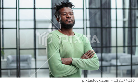 Portrait of a happy African American entrepreneur in office 122174136