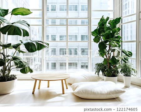 A bright minimalist living space with large windows, indoor plants, a wooden table 122174605