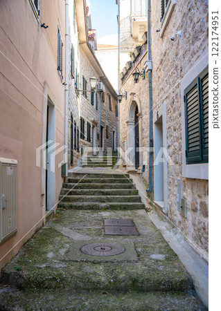 Narrow street without people in old town of Herceg Novi in Montenegro in winter time 122174951
