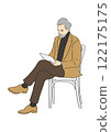 Senior man sitting and looking at a tablet 122175175