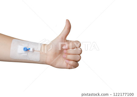 Happy patient concept. Hand with Peripheral venous catheter showing thumb up isolated  122177100
