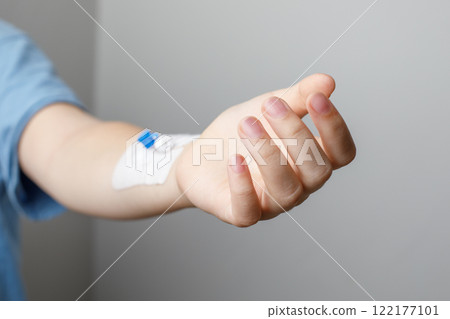 Patient hand with Catheter. Medicine and hospital concept 122177101