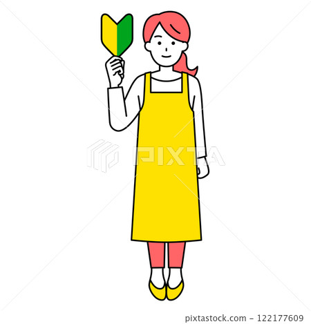A woman in an apron holding up a beginner's mark (full body) 122177609
