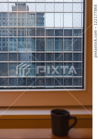 Mug cup and window view of urban city buildings Mug cup and window view of urban city buildings 122177868