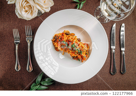 Spaghetti pasta with tomato sauce and olives 122177966