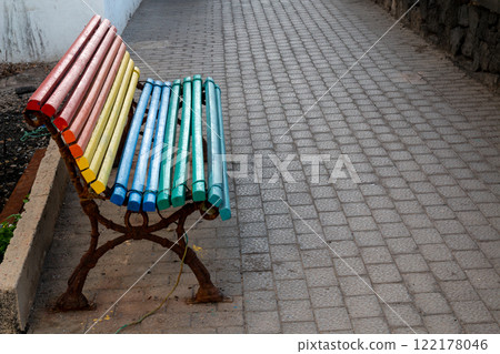 Bench on the pathway in rainbow colors, Spain Bench on the pathway in rainbow colors, Spain 122178046