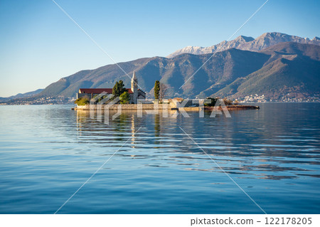 View of Our Lady of Mercy Island from yacht boat near Tivat city in Kotor bay of Adriatic sea in Montenegro in winter time View of Our Lady of Mercy Island from yacht boat near Tivat city in Kotor bay of Adriatic sea in Montenegro in winter time 122178205