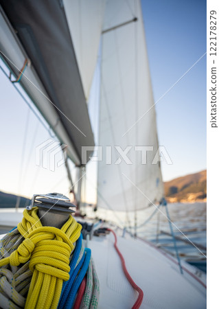 Yacht sailing in Adriatic sea. Close-up view of the deck, mast and sails. Yachting concept Yacht sailing in Adriatic sea. Close-up view of the deck, mast and sails. Yachting concept 122178279