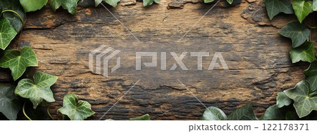 green leaves on a wooden background 122178371