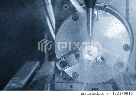 The 4-axis CNC milling machine  cutting the turbocharger part with liquid coolant method. 122179916