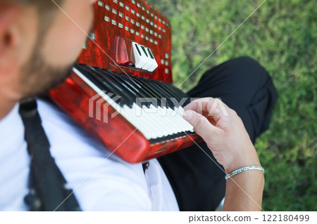 Joyful Melodies Flowing from Accordion Player Joyful Melodies Flowing from Accordion Player 122180499