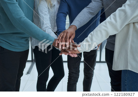 Panoramic shot of cheerful business colleagues holding hands Panoramic shot of cheerful business colleagues holding hands 122180927