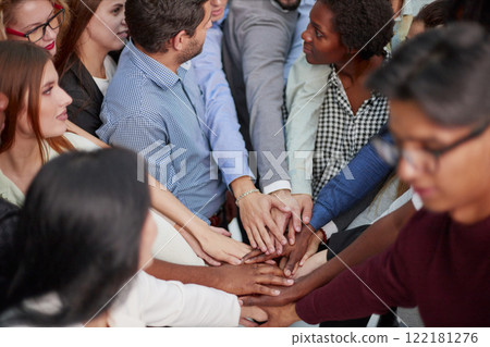 Multiethnic college students fold their hands in place Multiethnic college students fold their hands in place 122181276