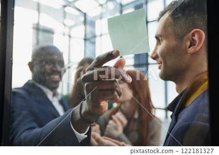 Young happy multiethnic diverse young professional creative team group students talking brainstorming 122181327