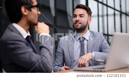 Business people discussing over new business project in office. Business people discussing over new business project in office. 122181331