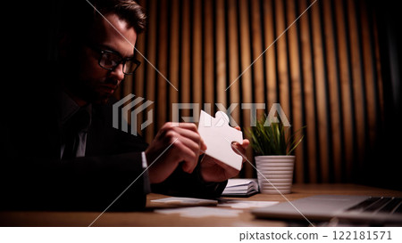 Attractive young guy is solving a problem 122181571