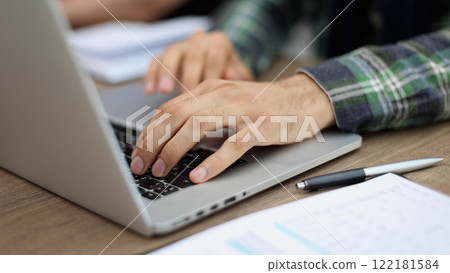 close up business male use laptop computer in office close up business male use laptop computer in office 122181584